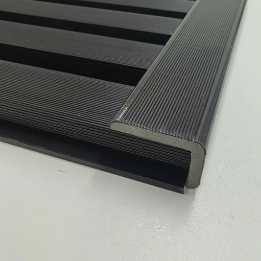 A seamless architectural finish featuring a Black trim installed on a matching horizontal slat wall, providing clean edges and professional corner protection.