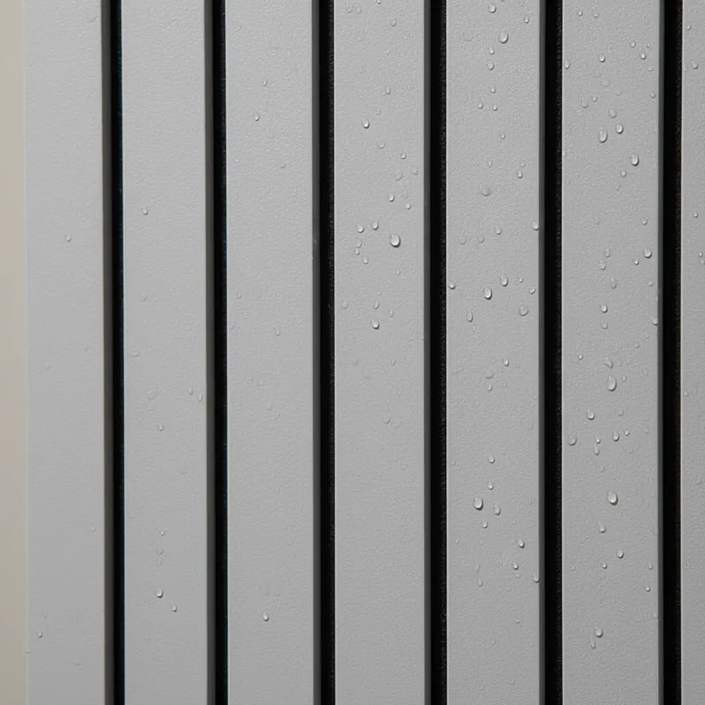 Close-up detail of water-resistant dark oak PVC slat panel showing a realistic wood grain texture with water droplets for interior wall cladding.
