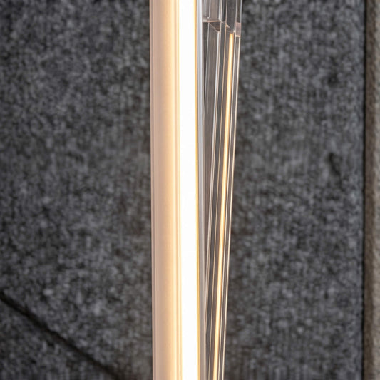 Macro view of a high-end black architectural LED strip housing with a custom frosted diffusion lens designed to prevent hot spotting on luxury interior accent walls.