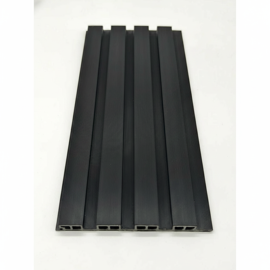 Top-down close-up of a Black 240cm WPC outdoor panel showing the 2.4cm fluted slat profile and hollow-core weather-resistant engineering.
