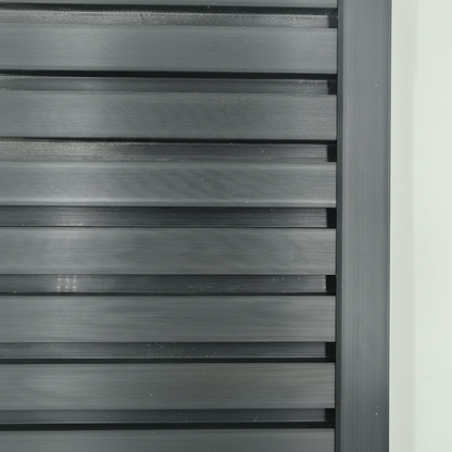 A sleek black architectural trim providing a seamless edge finish to a modern slat wall installation.