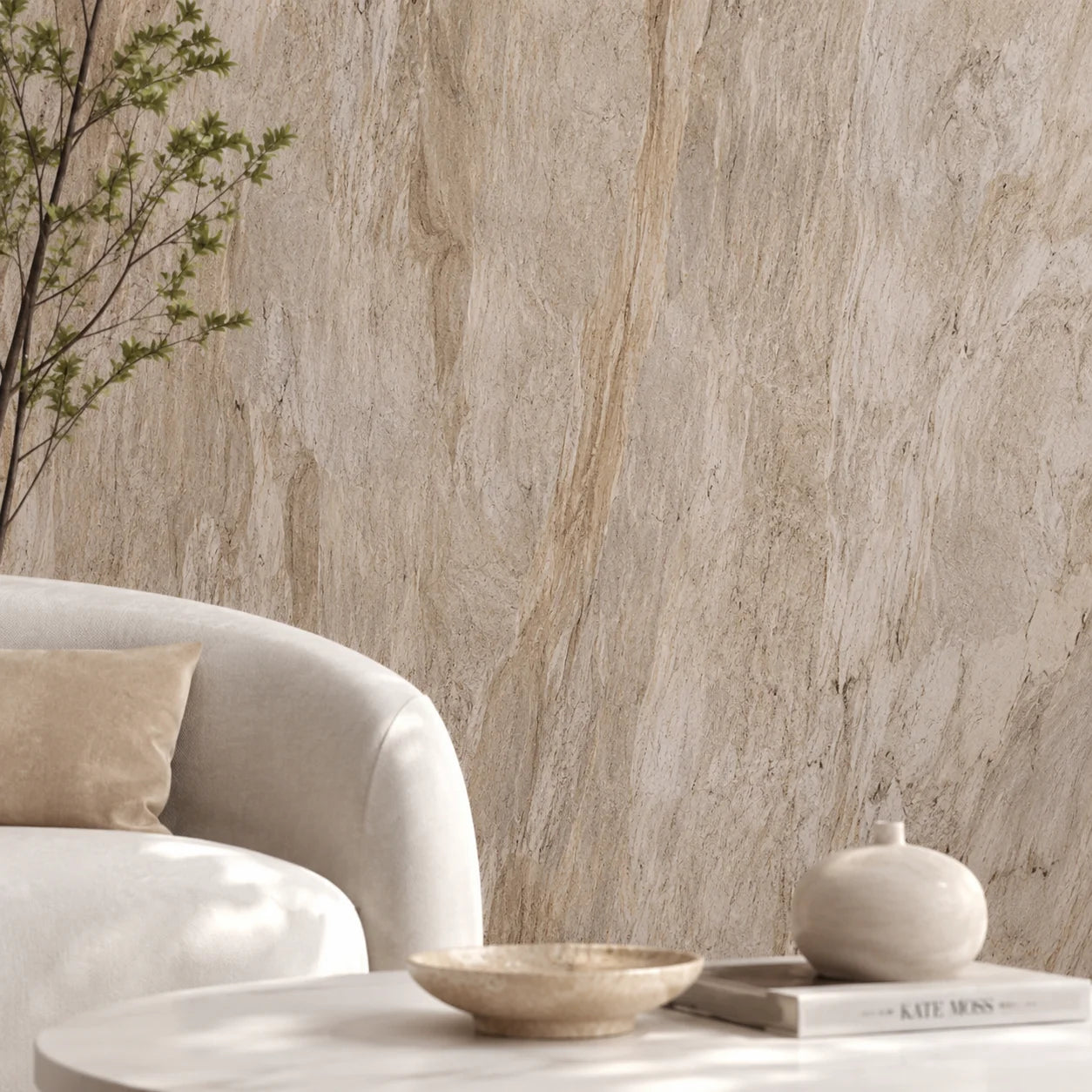 Detailed shot of a luxury lounge room setting showcasing a seamless cream stone PVC cladded wall behind a white curved sofa and coffee table.
