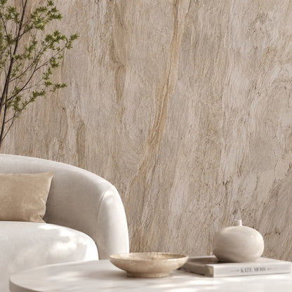 Detailed shot of a luxury lounge room setting showcasing a seamless cream stone PVC cladded wall behind a white curved sofa and coffee table.