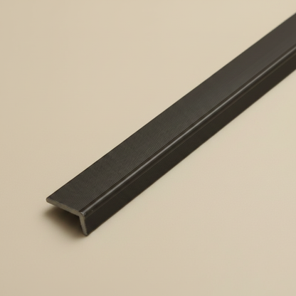 A deep-angle view of a 240cm Dark Brown architectural trim, showcasing its durable Wood-Plastic Composite (WPC) texture and sleek L-profile design.
