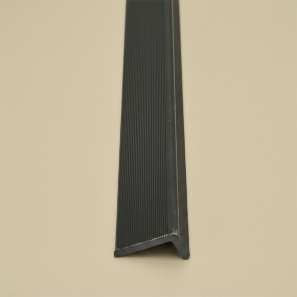 A flat-lay view of the Dark Brown composite edge trim, highlighting its uniform color and textured surface for professional outdoor cladding finishes.