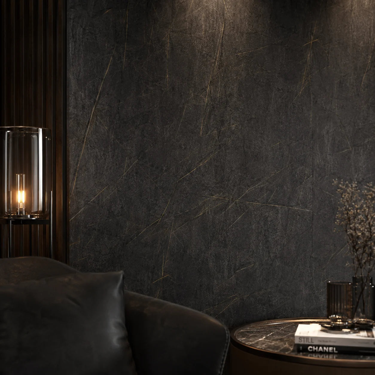 Mood lighting in a luxury living room setting showcasing a seamless dark marble PVC cladded wall behind a black leather armchair.