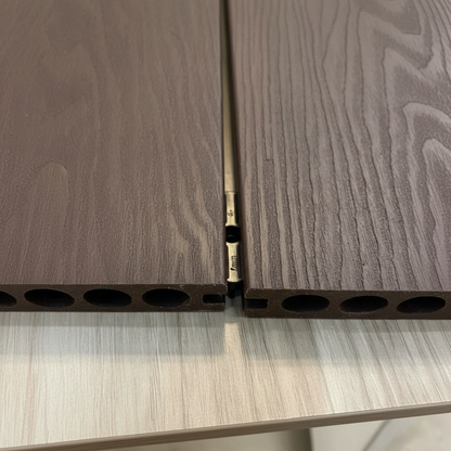 Seamless joint between two composite decking boards using Churchill Panels fittings.