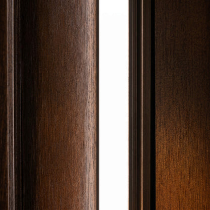 Close-up view of a ultra-discreet, 10mm x 9mm flush-mount white LED accent light integrated perfectly between premium dark wood acoustic paneling with no bulky trim.