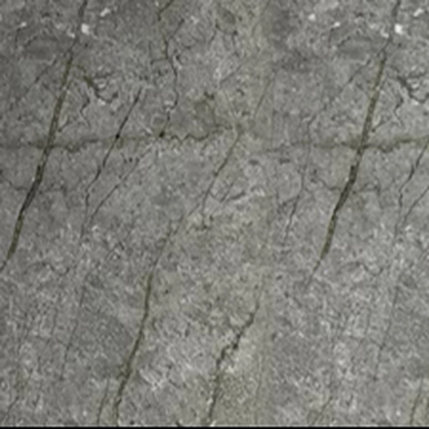 Close-up seamless texture of a gold and grey marble PVC wall cladding board, featuring organic dark veining and subtle gold undertones for high-end interior surfaces.