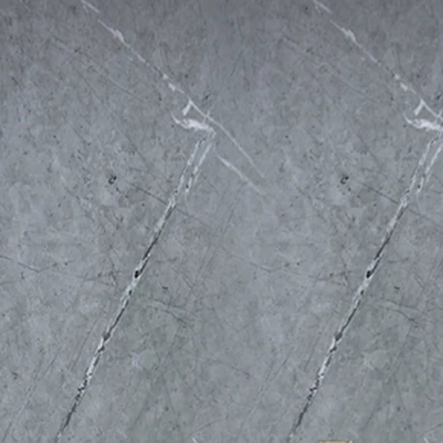 Close-up texture of a grey marble PVC wall cladding board, showing realistic white and dark grey veining for modern interior design.