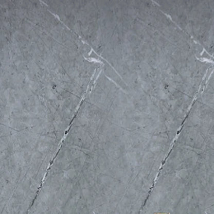 Close-up texture of a grey marble PVC wall cladding board, showing realistic white and dark grey veining for modern interior design.