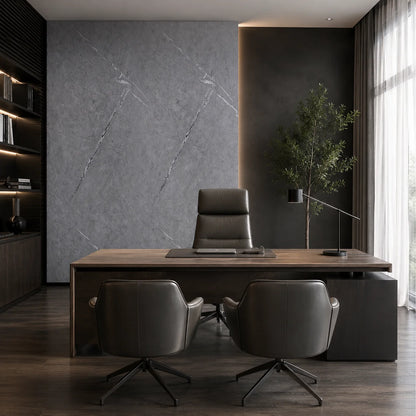 Modern office room featuring a luxury grey marble PVC wall cladding accent panel behind an executive desk and leather chairs.