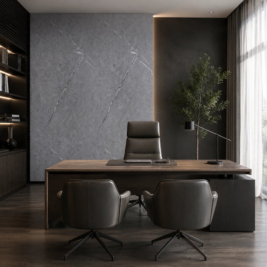 Modern office room featuring a luxury grey marble PVC wall cladding accent panel behind an executive desk and leather chairs.