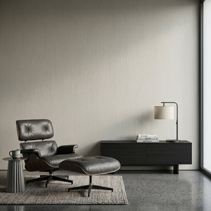 Minimalist modern interior design showcasing a grey wood-grain SPC feature wall board setup with a black lounge chair and sleek media console layout.