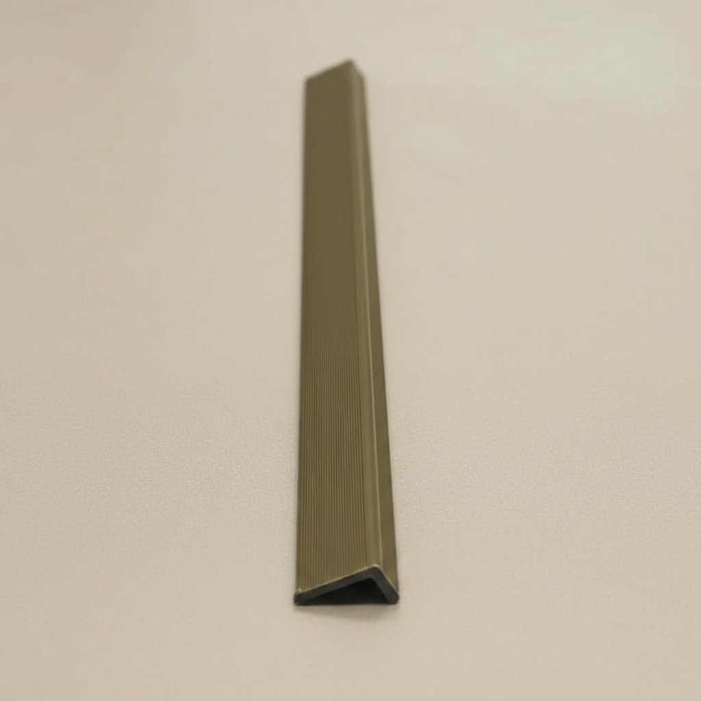 Detailed close-up of the Khaki composite edge trim's profile, designed for UV-resistant outdoor wall cladding and professional edge finishing.
