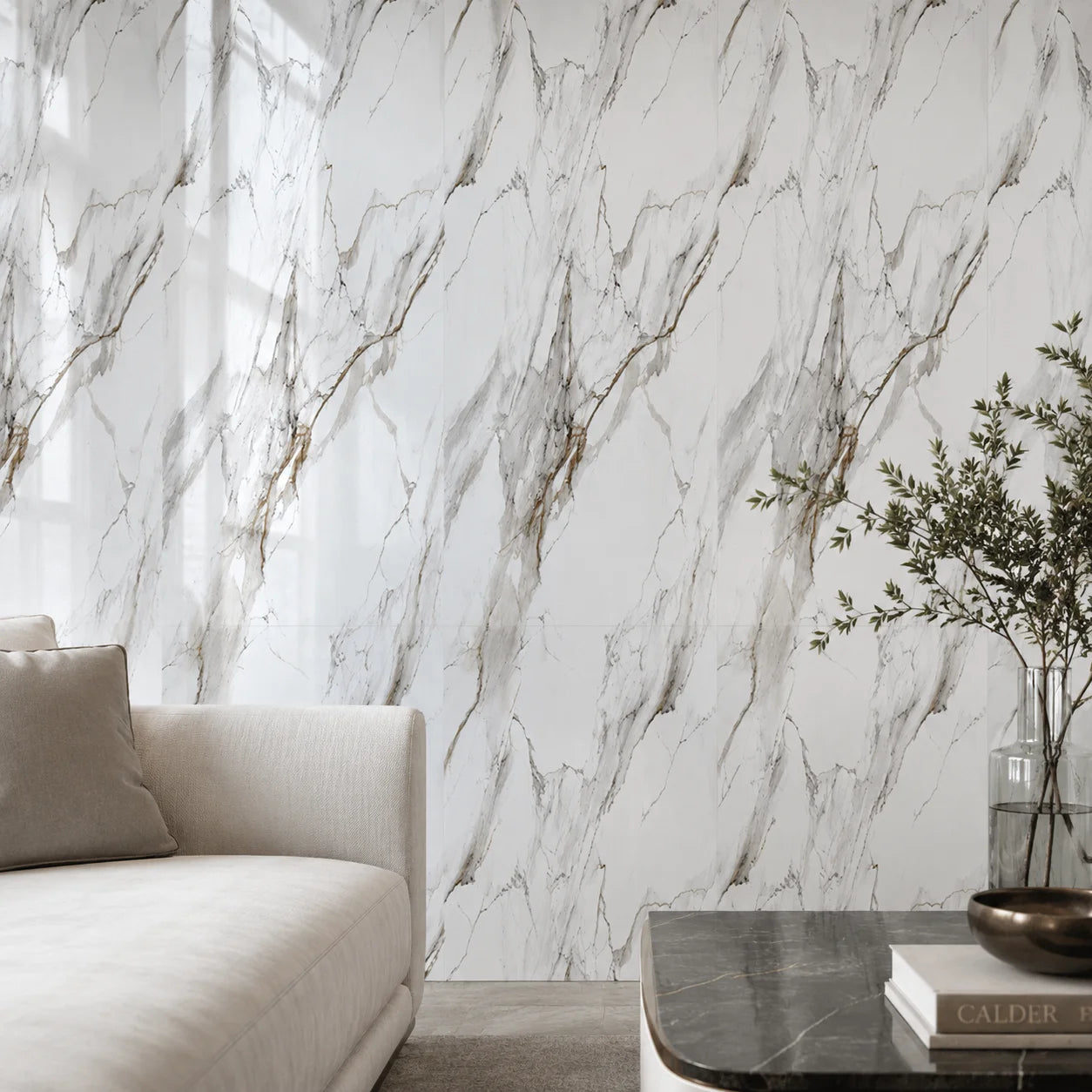 Close shot of a modern sofa lounge setting highlighting a high-gloss white and gold marble PVC wall cladding installation reflecting ambient interior light.