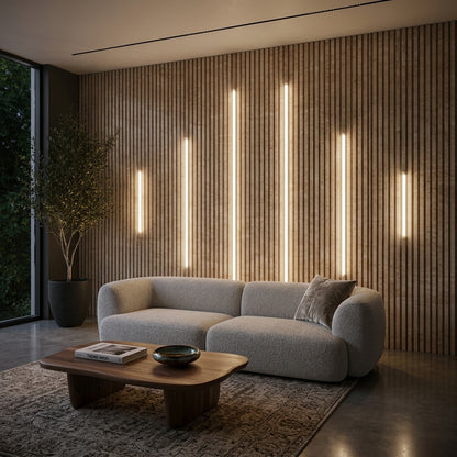 Premium LED lighting kit providing ambient accent light on natural oak acoustic wall panels behind a contemporary sofa.