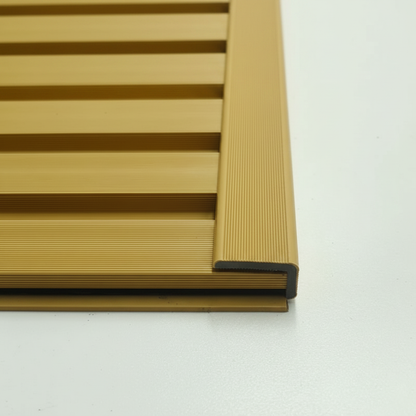 Oak architectural trim perfectly installed on the edge of a matching horizontal slat wall panel for a professional finish.