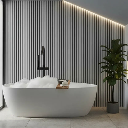 Moisture-resistant light grey PVC slat panel close-up, showcasing vertical lines and water-resistant surface texture for minimalist wall paneling.