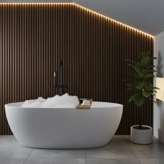 Sophisticated bathroom interior showcasing rich walnut brown PVC slat wall panels as a moisture-proof accent wall behind a white freestanding tub.