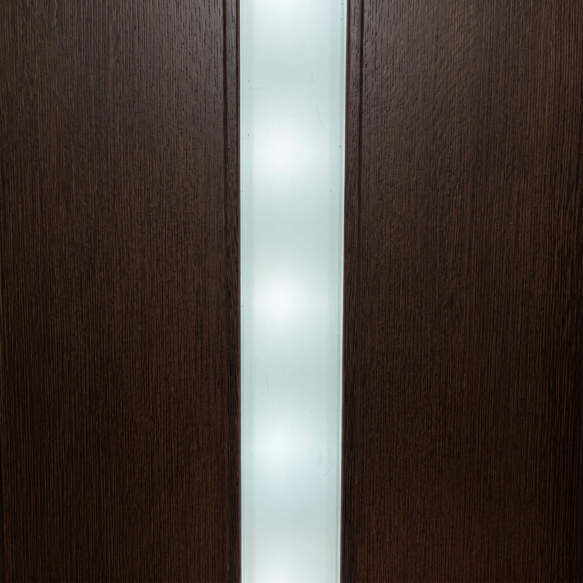 Seamless dot-free modern white LED light strip glowing elegantly inside a dark timber slat wall groove, showcasing the hidden visibility aesthetic.